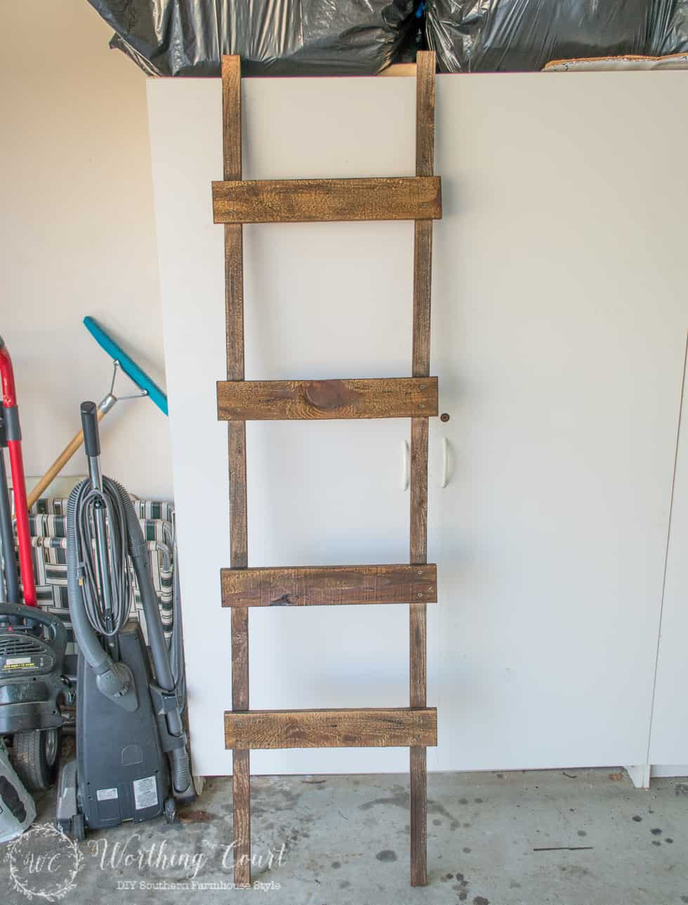 How To Make A Rustic Blanket Ladder For Under $20 - Worthing Court | DIY Home Decor Made Easy