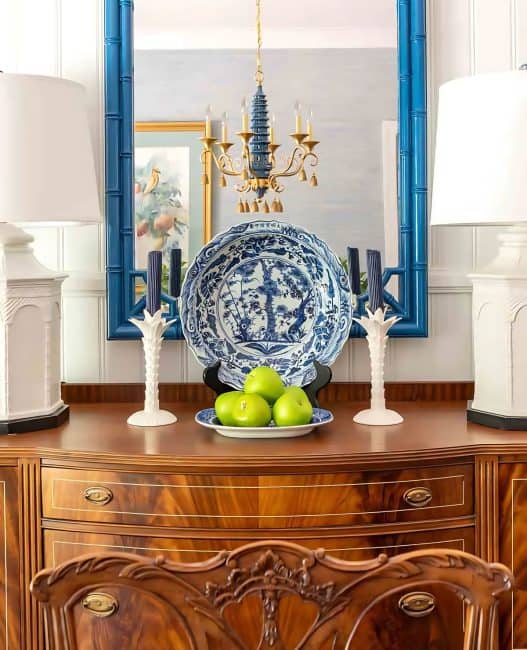 dining room with traditional brown furniture and chinoiserie accessories