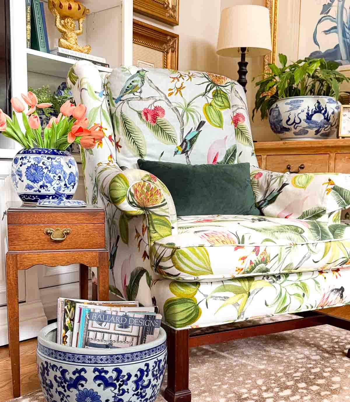 armchair with colorful upholstery in a living room decorated with colorful spring accessories