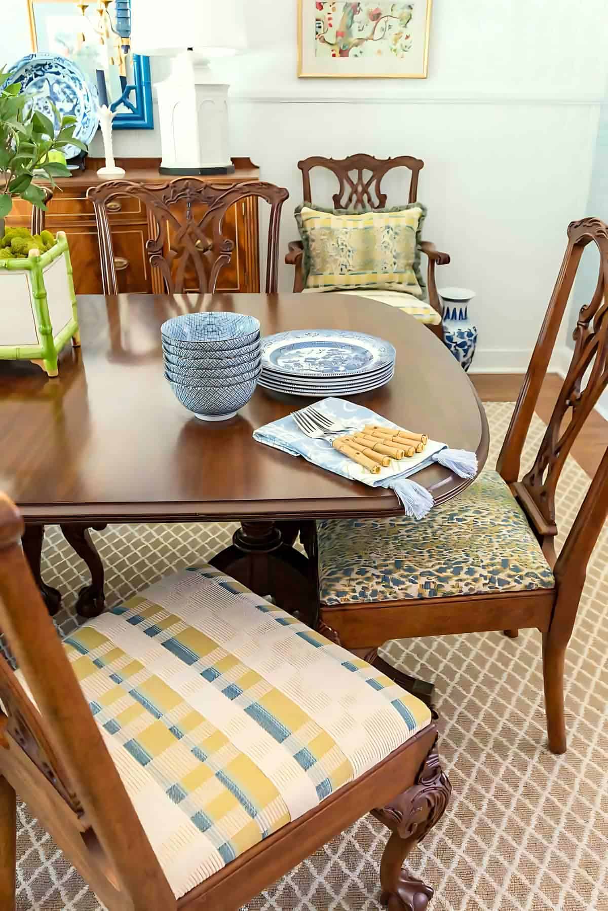 dining room with traditional brown furniture and chinoiserie accessories