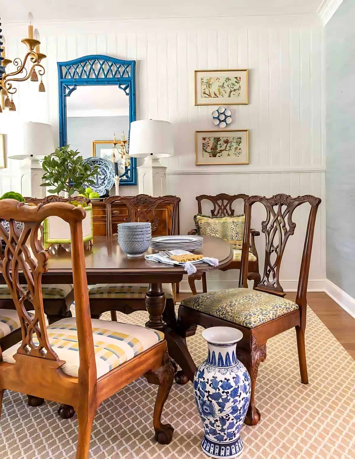 dining room with traditional brown furniture and chinoiserie accessories