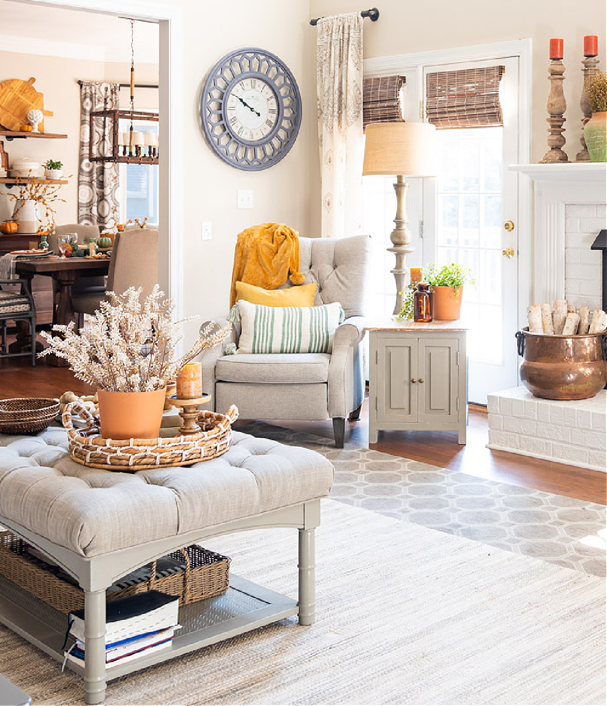 family room with neutral furniture and muted pops of fall accent colors