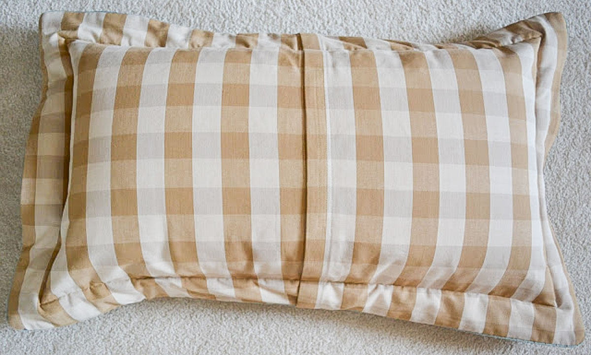 back side of a brown and tan checked pillow sham