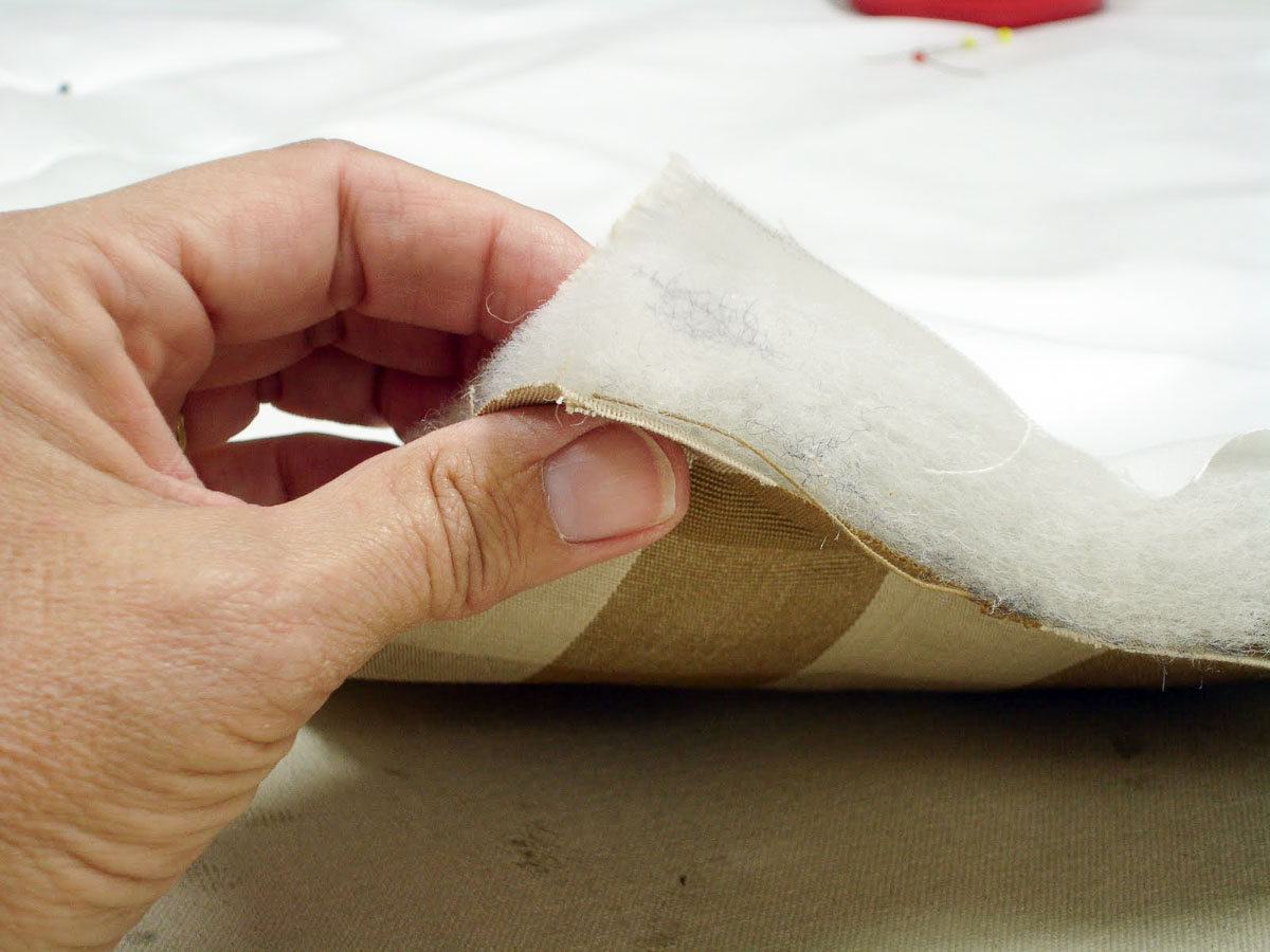 layers of fabric and batting for making a pillow sham