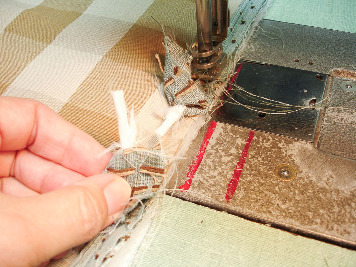blue covered cording being applied to the right side of the fabric for a pillow sham