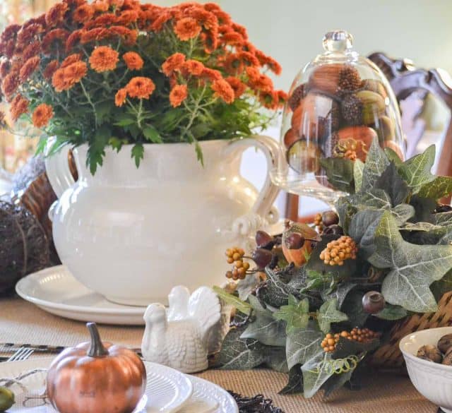 fall colored mum in a white soup tureen