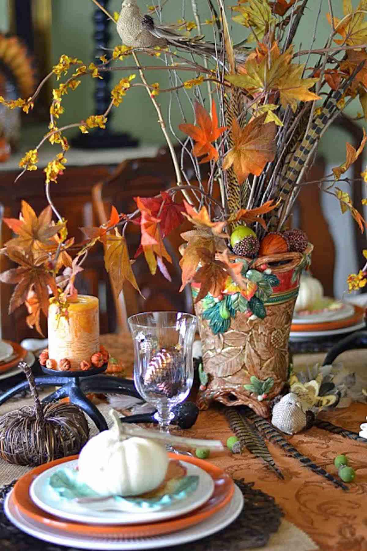 bountiful thanksgiving tablescape set with a variety of fall and traditional thanksgiving colors and elements