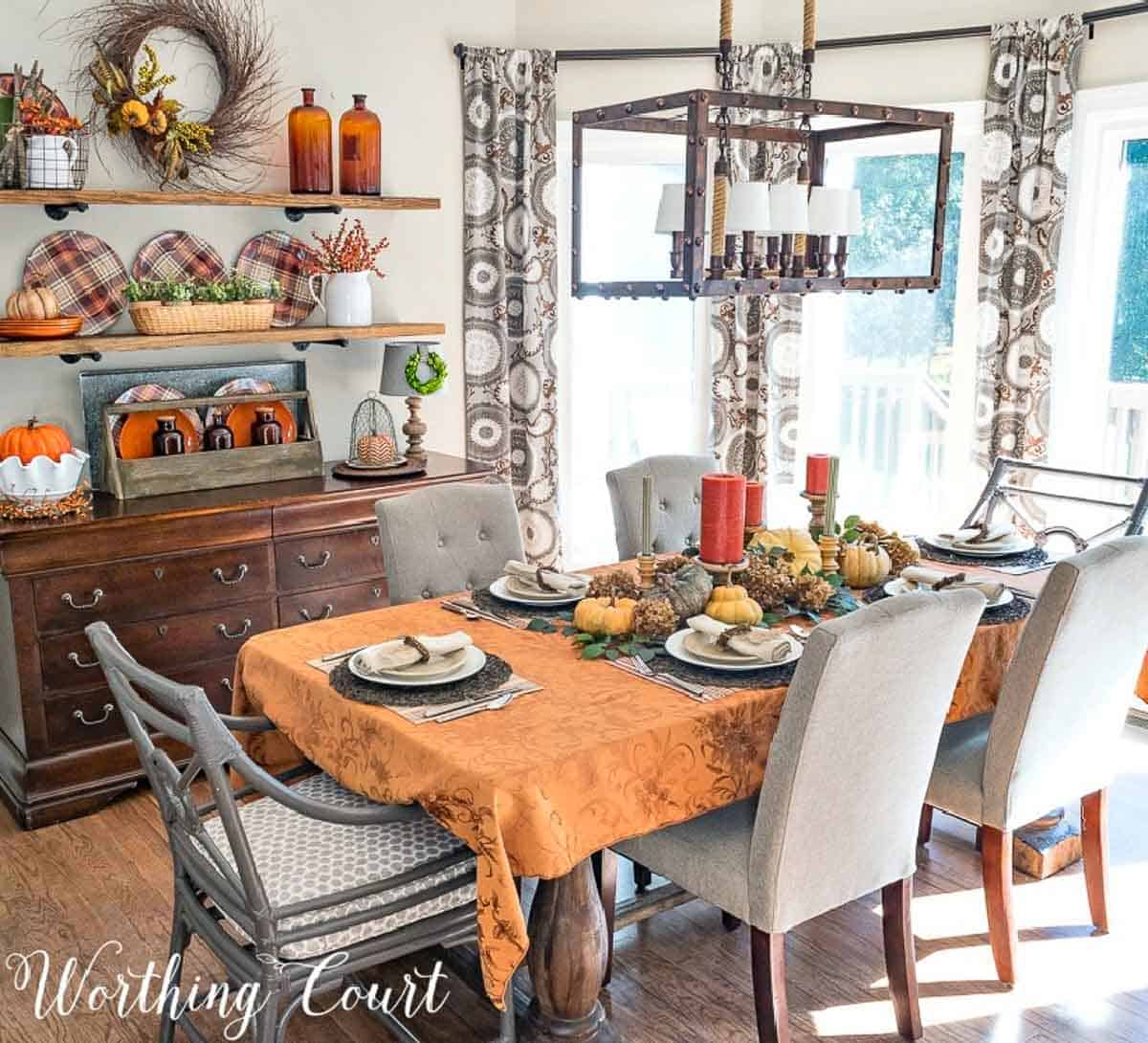 Thanksgiving tablescape with traditional fall colors and lots of natural elements