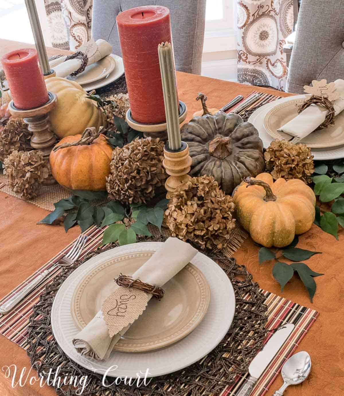 Thanksgiving tablescape with traditional fall colors and lots of natural elements