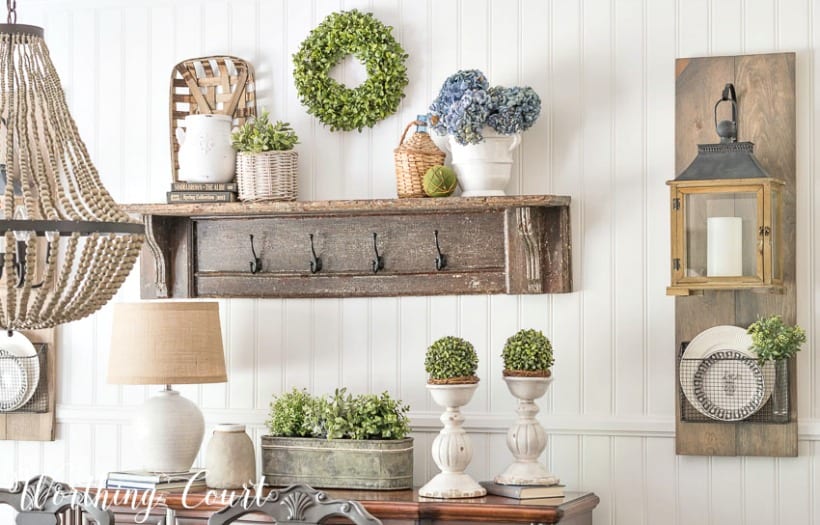 https://www.worthingcourtblog.com/wp-content/uploads/2018/07/Farmhouse-Dining-Room-Makeover-with-planked-wall-diy-hanging-lanterns-vintage-shelf-with-white-accessories-1.jpg