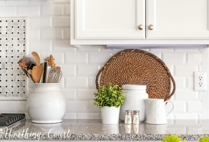 https://www.worthingcourtblog.com/wp-content/uploads/2018/07/white-beveled-subway-tile-backsplash-with-granite-counters-and-white-kitchen-accessories.jpg