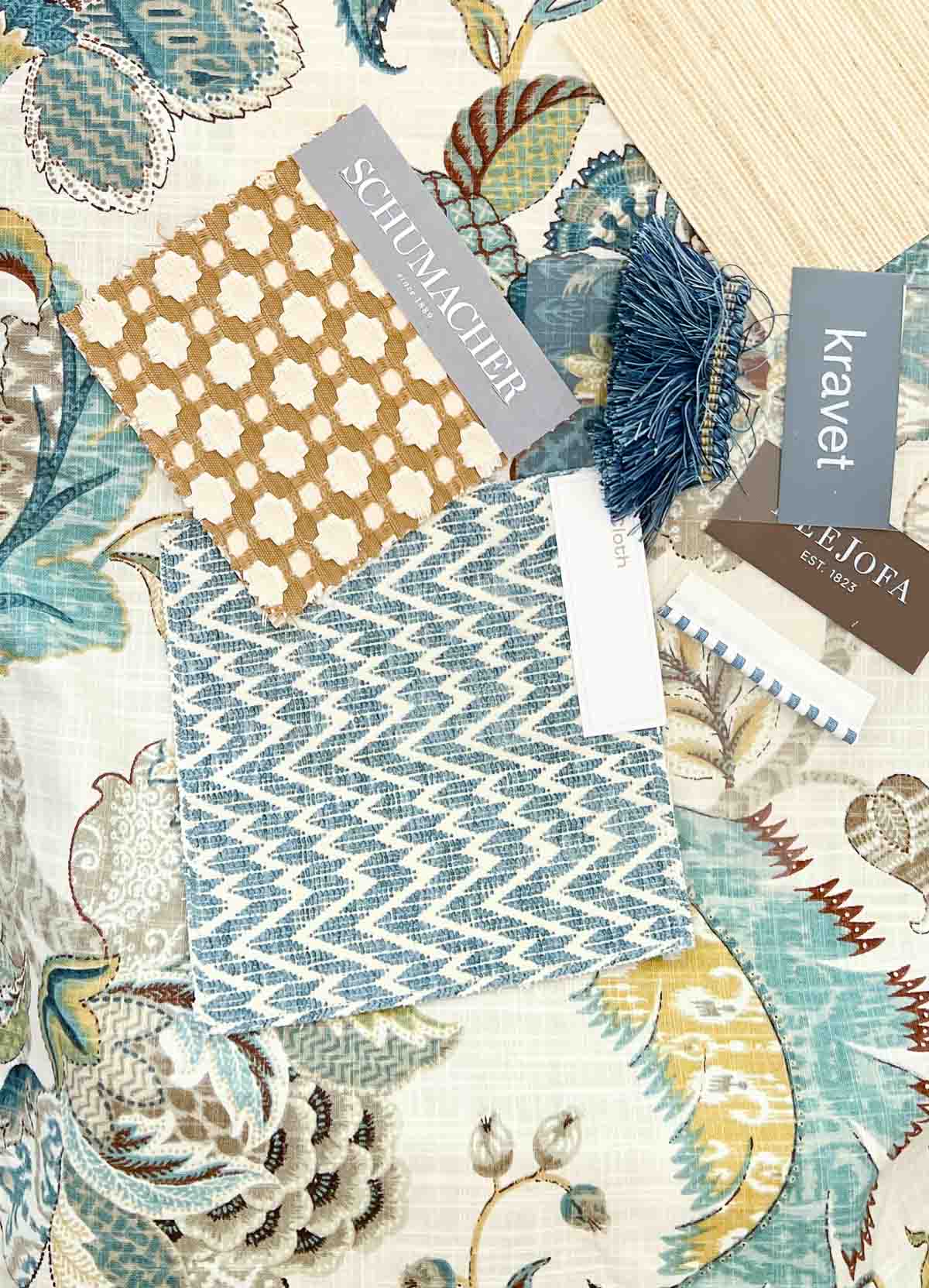 overhead view of a assorted fabric sample in blue, white and beige tones