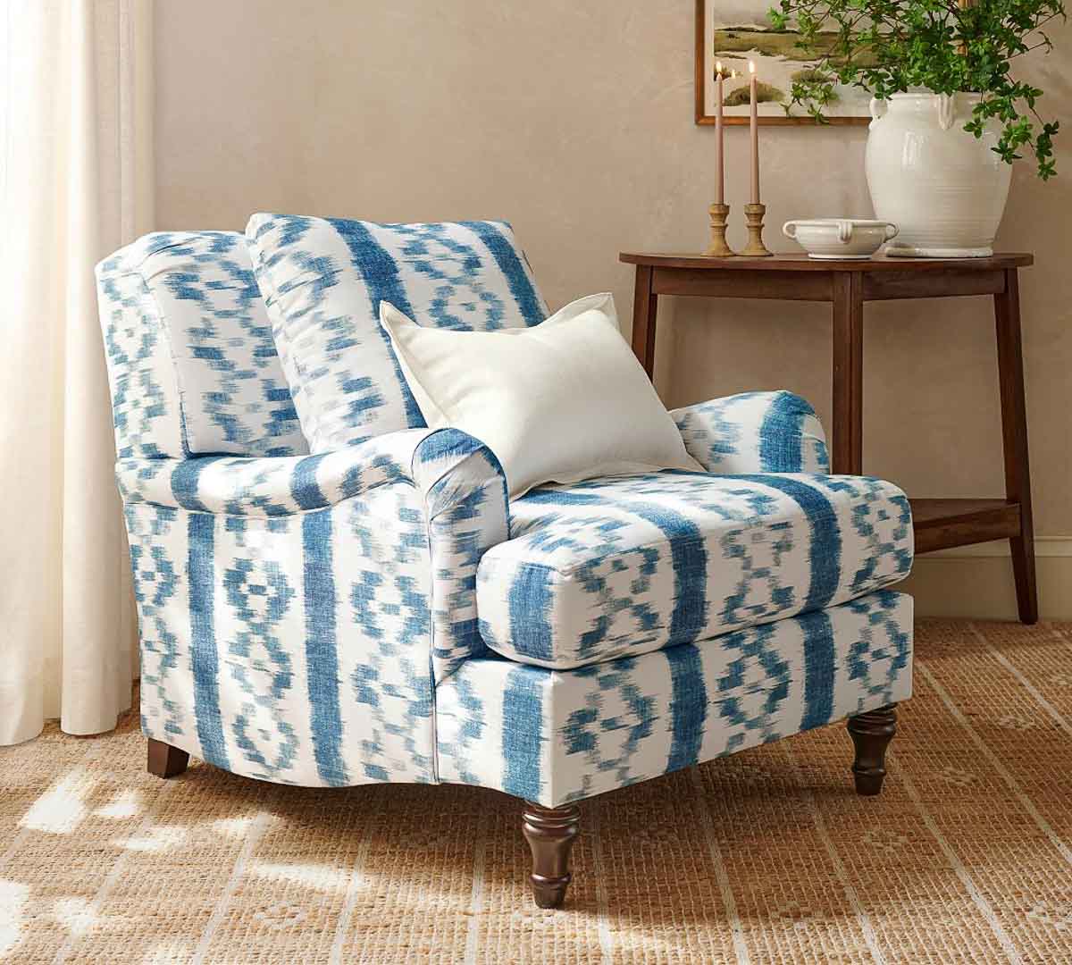 armchair upholstered with blue and white striped fabric