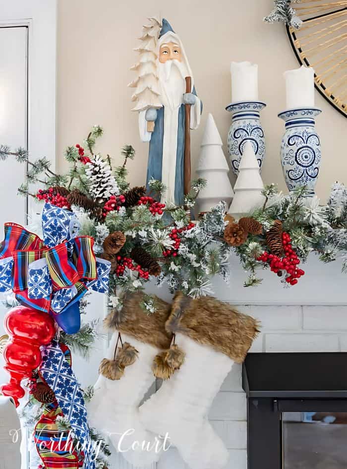 blue and white with pops us red Christmas mantel decor