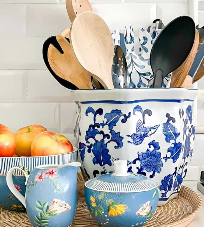 cooking utensils in a blue and white ceramic container