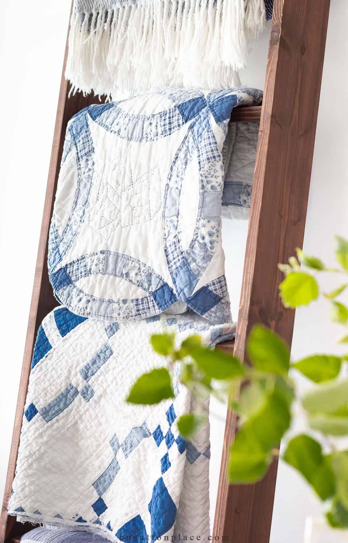 folded quilt on a blanket ladder