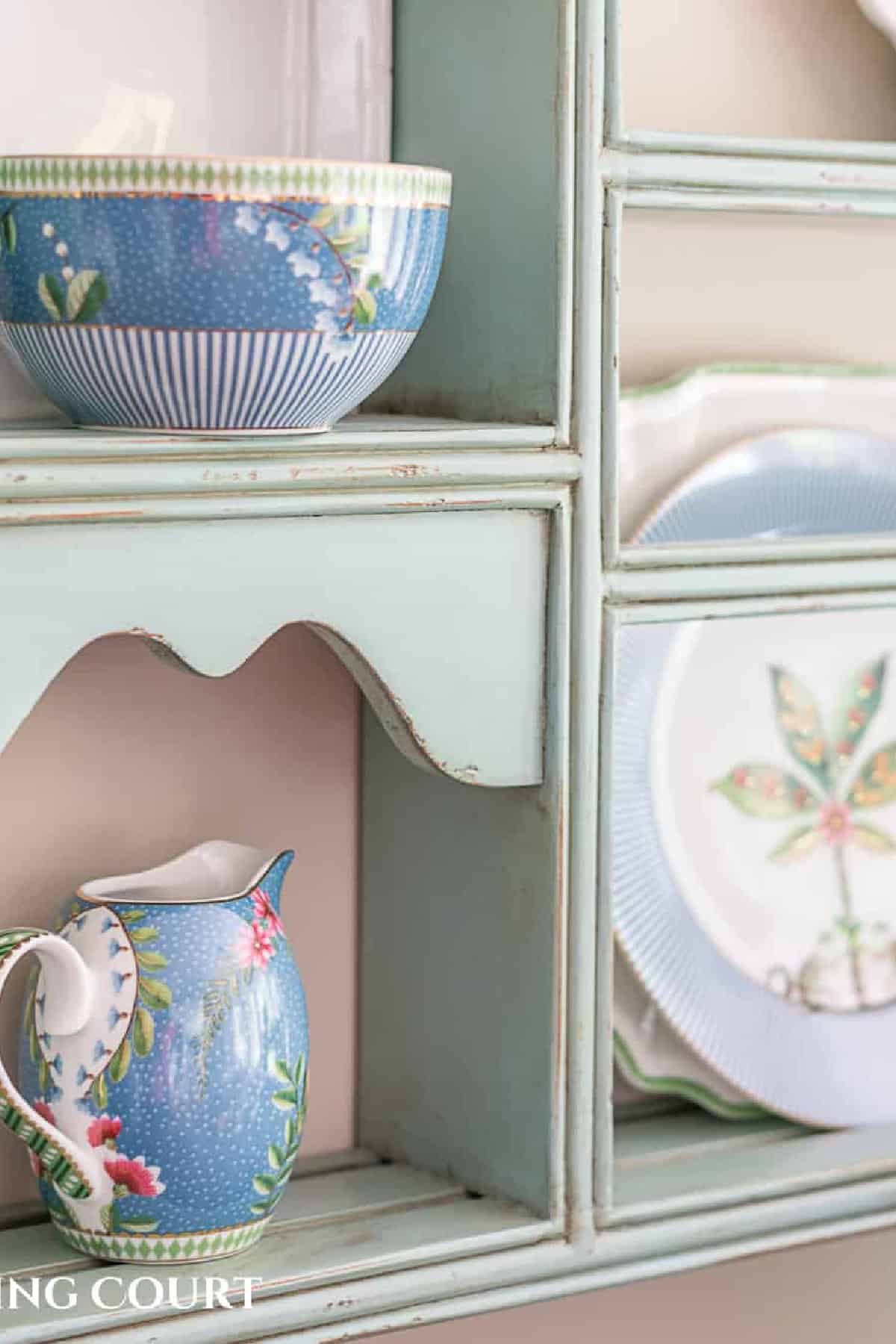 partial image of decorative plates on a plate rack