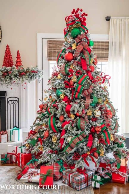 Christmas tree with red and green oranaments and ribbon