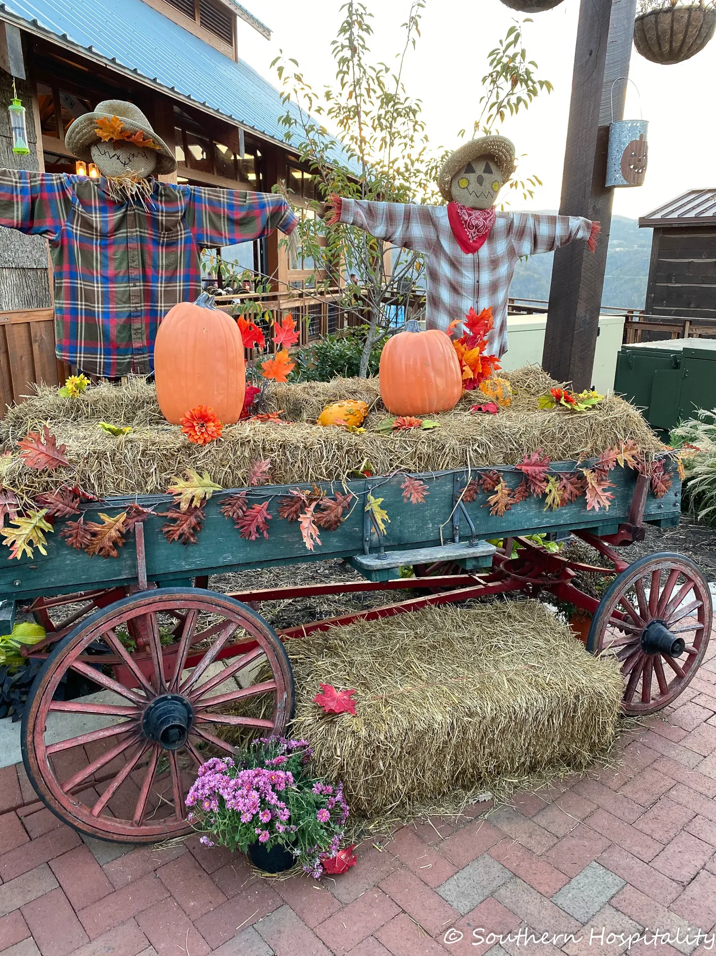 wagon with bales of hay and pumpkins on it