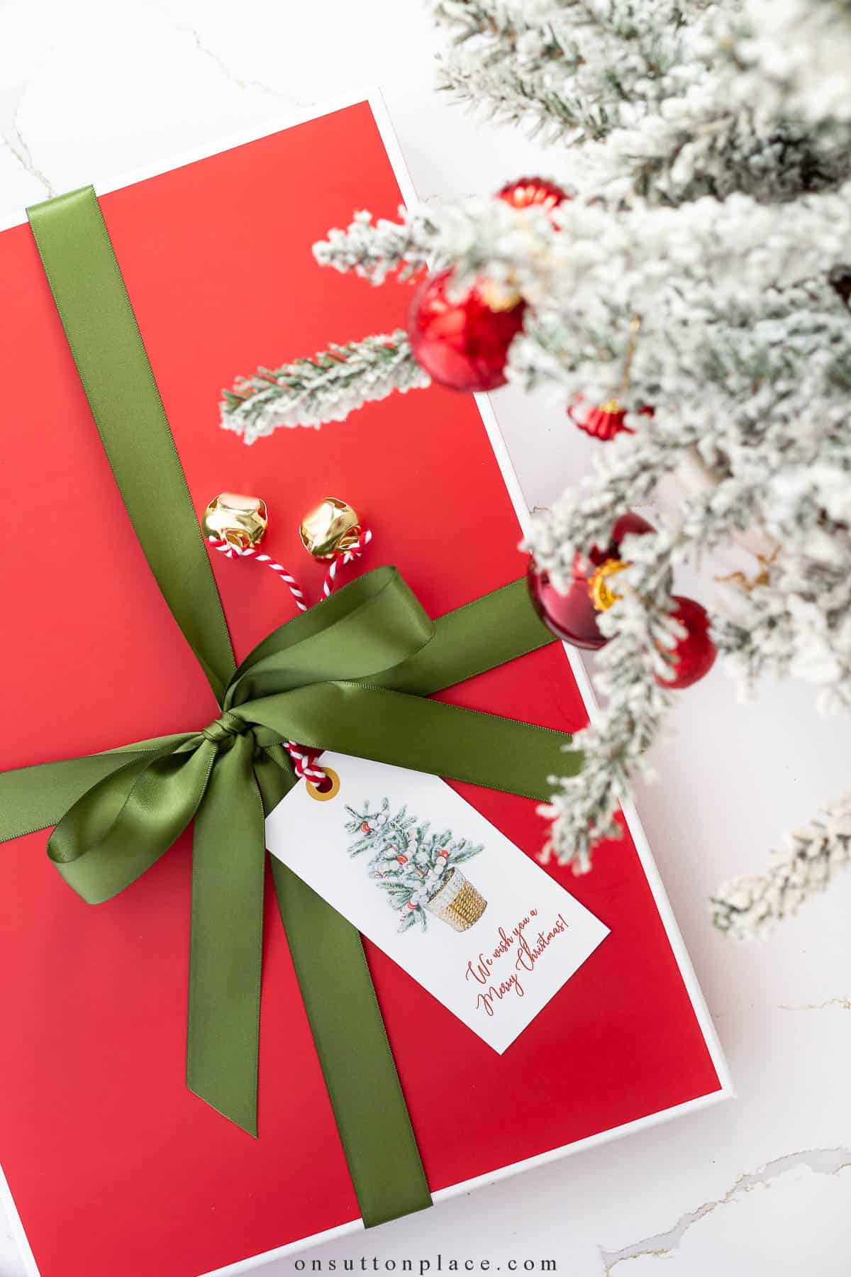 gift wrapped with red paper and a green ribbon