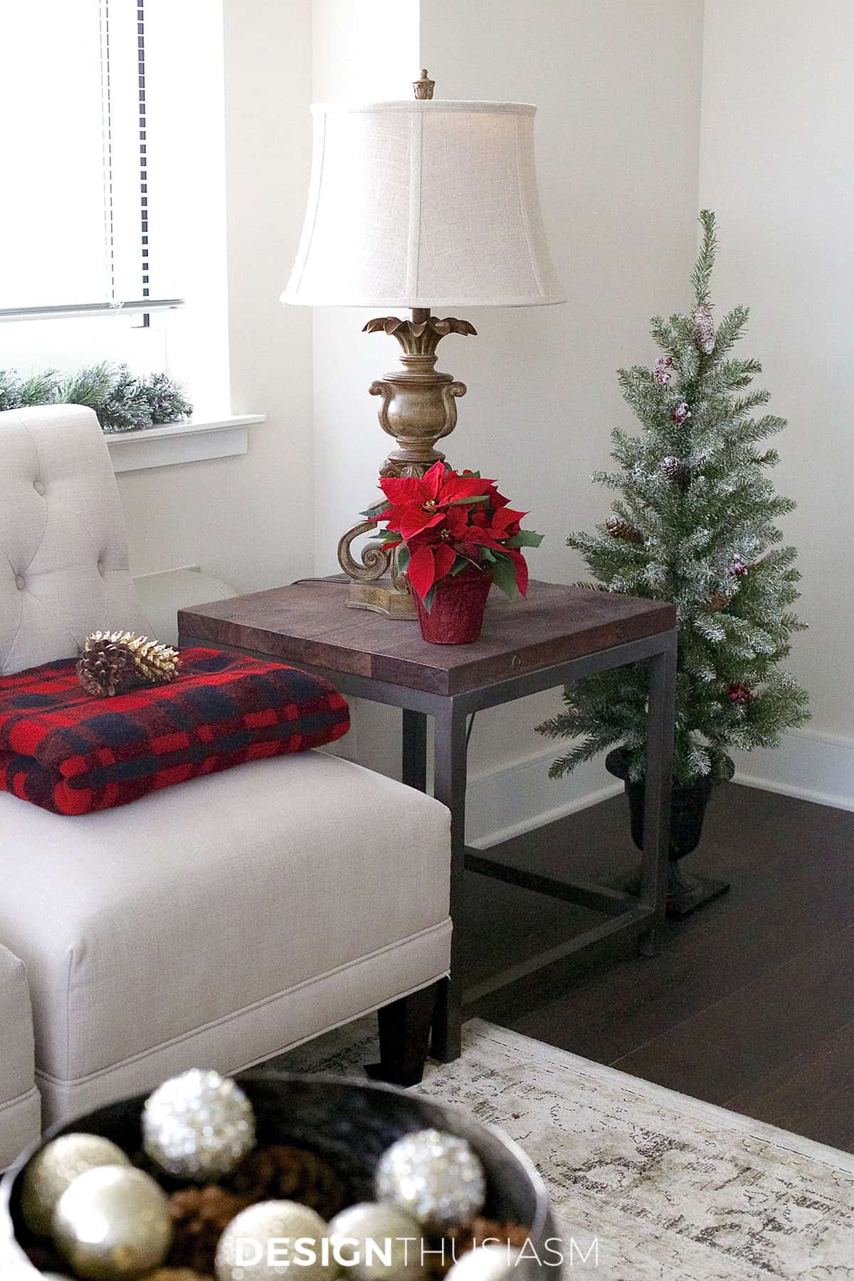 white chair and wood end table with burgundy accents