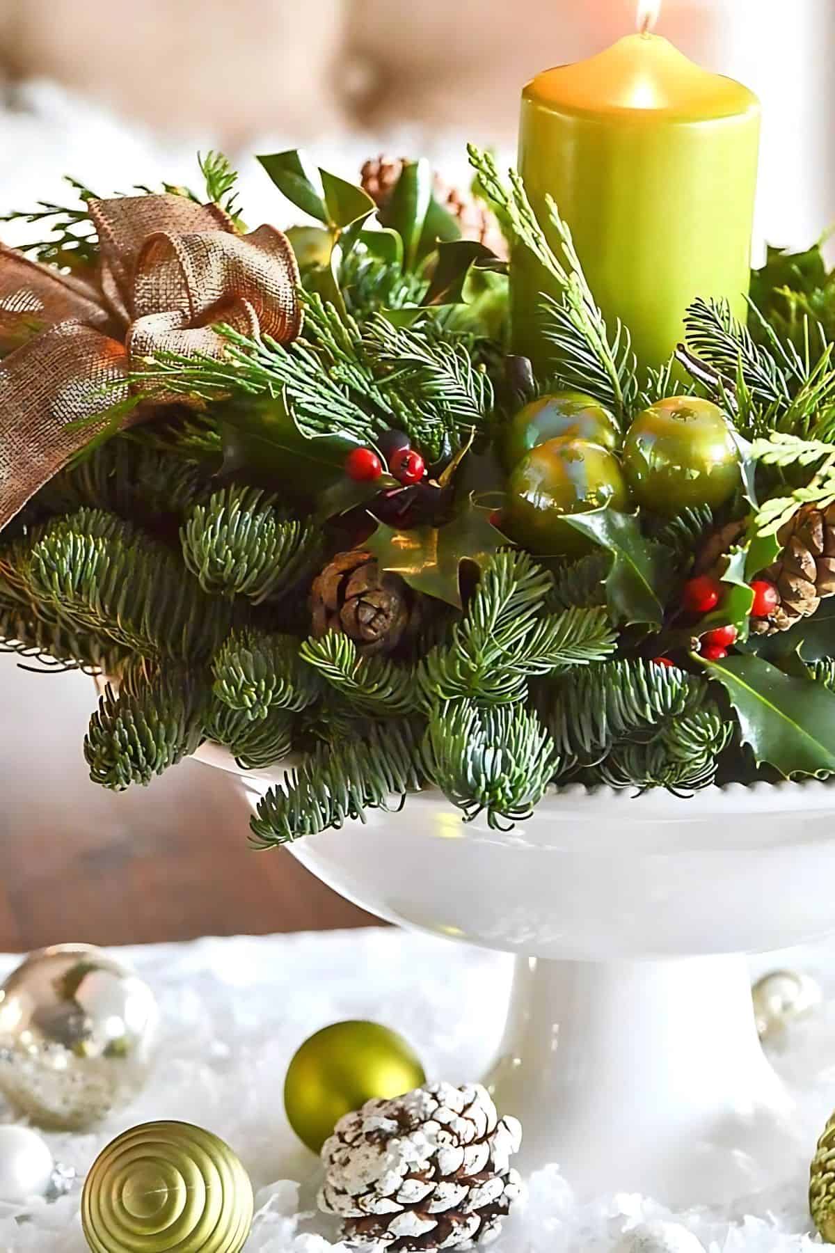 white pedestal bowl filled with live Christmas greenery