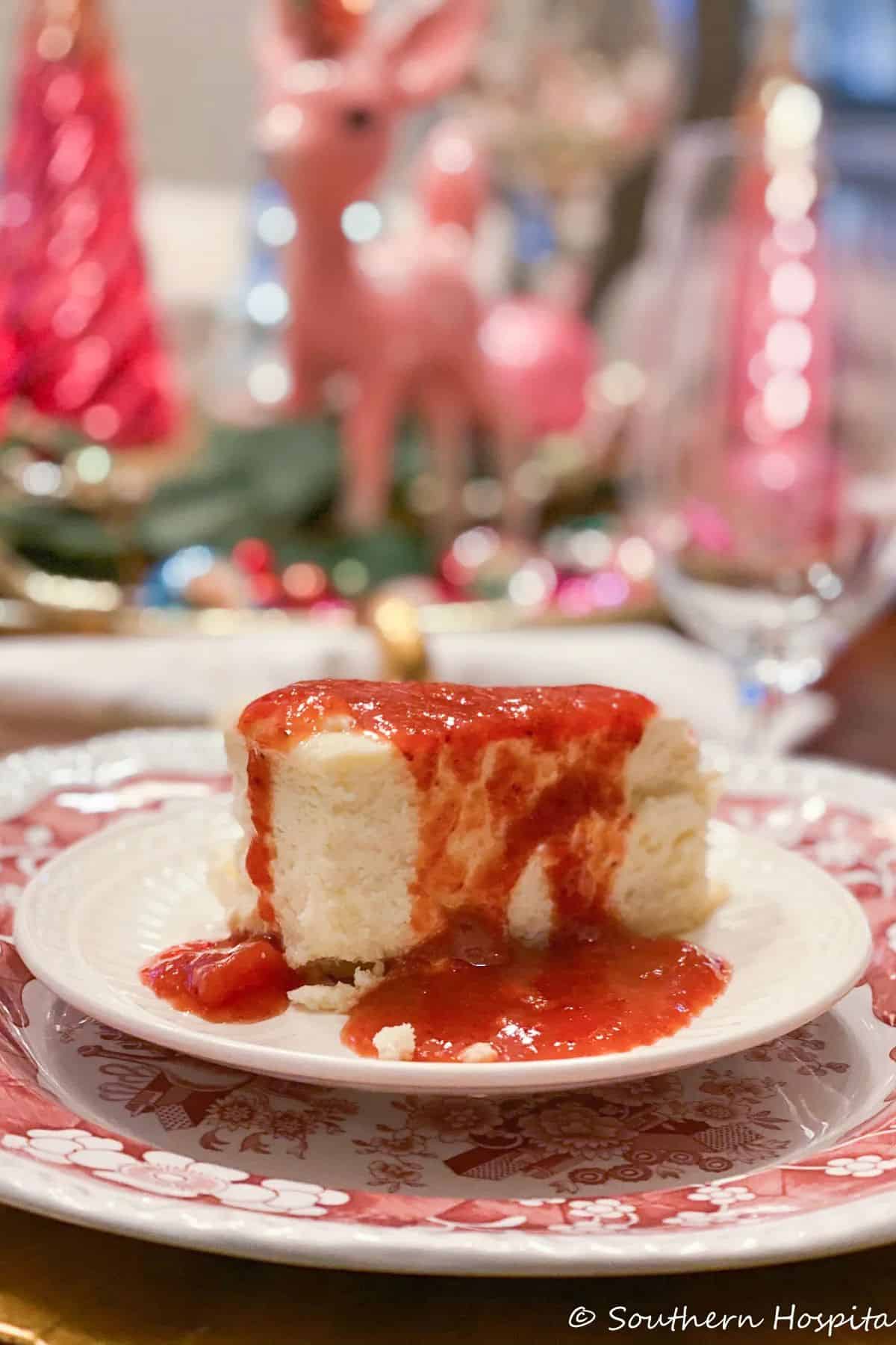 a piece of italian cheesecake with strawberry sauce