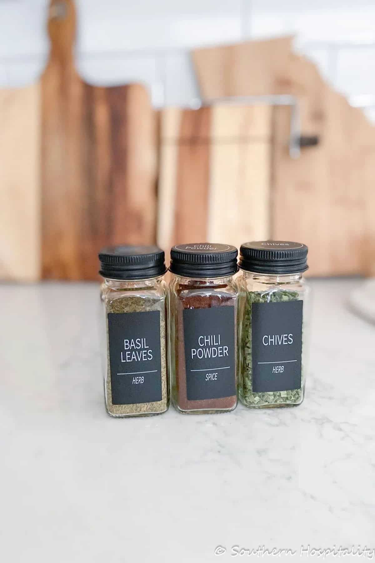 3 spice jars on a counter