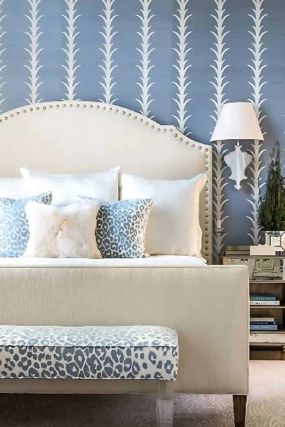 Adding a pop of blue with wallpaper in a bedroom with neutral furnishings and decor