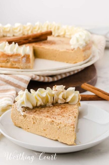 a piece of gingerbread cheesecake on a white dessert plate