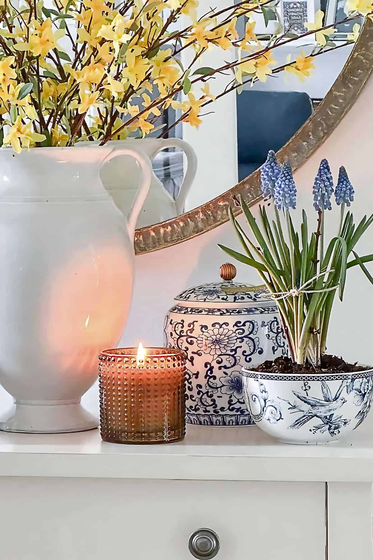 white console table with blue and white spring accessories