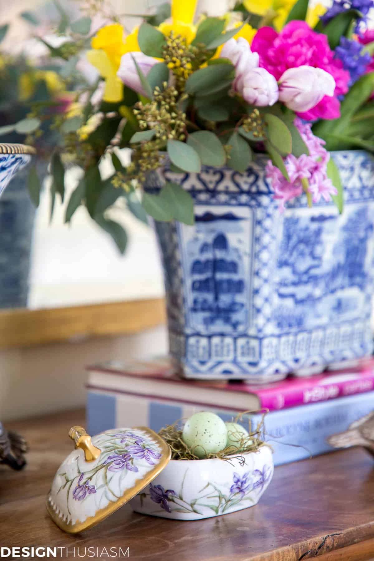 blue and white chinoiserie planter with spring flowers in a spring vignette