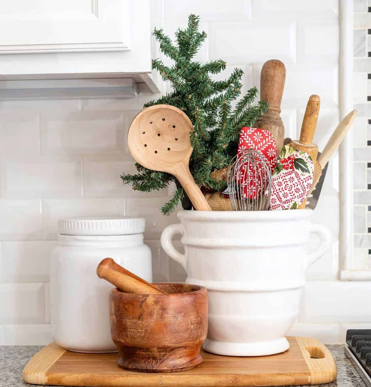 utensil container beside stove with Christmas spatulas