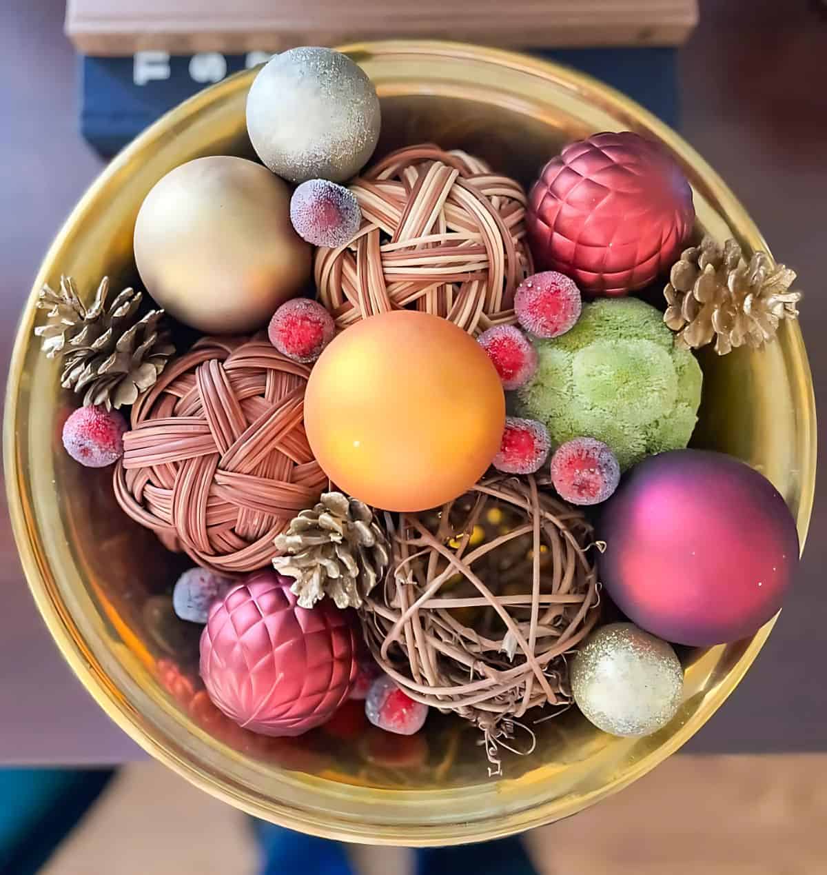 brass bowl filled with Christmas bits and baubles