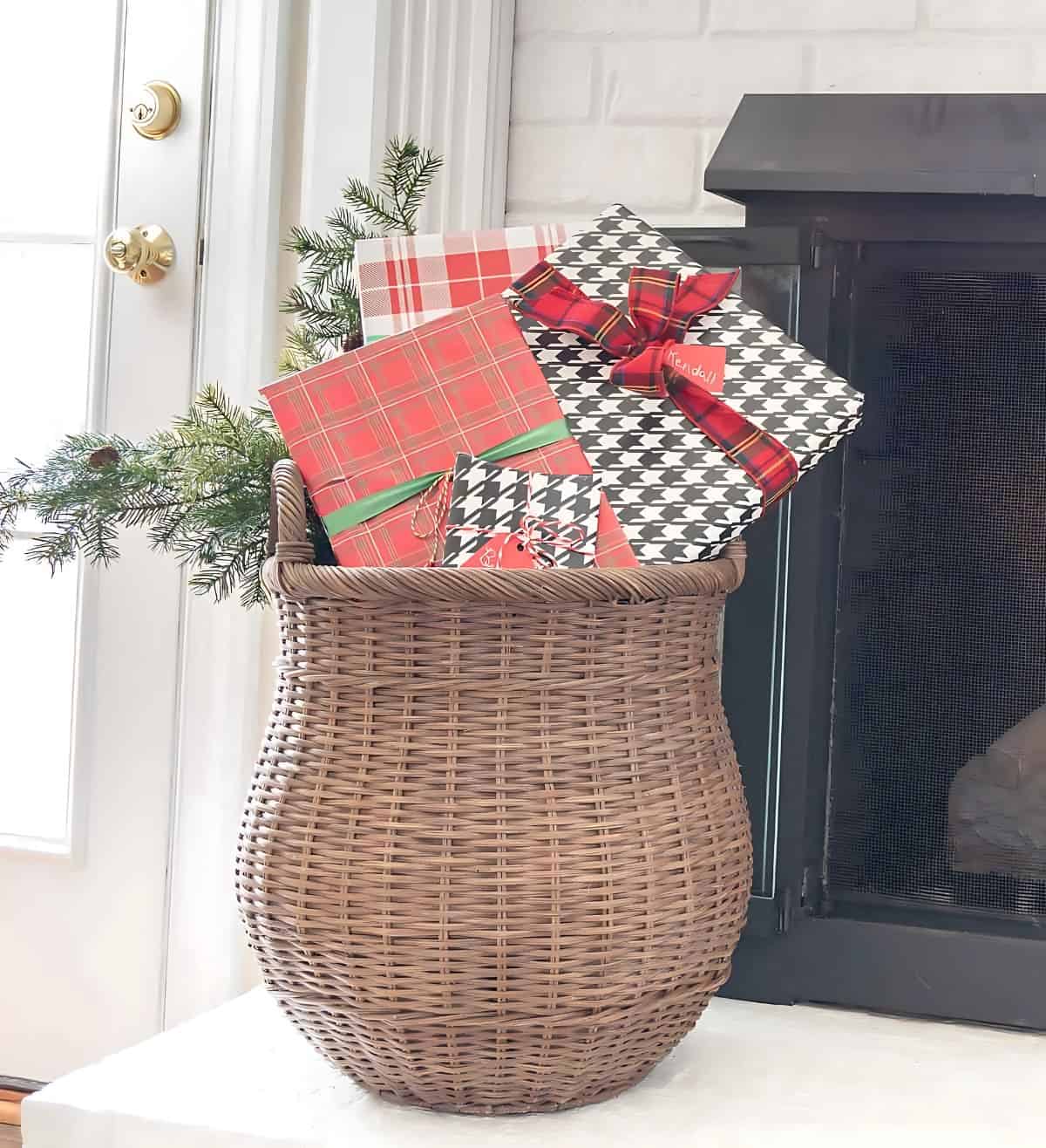 large basket filled with wrapped Christmas gifts