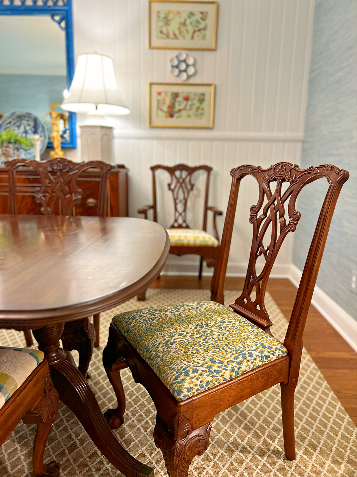 traditional style mahogany dining room chair upholstered with blue and green leopard fabric