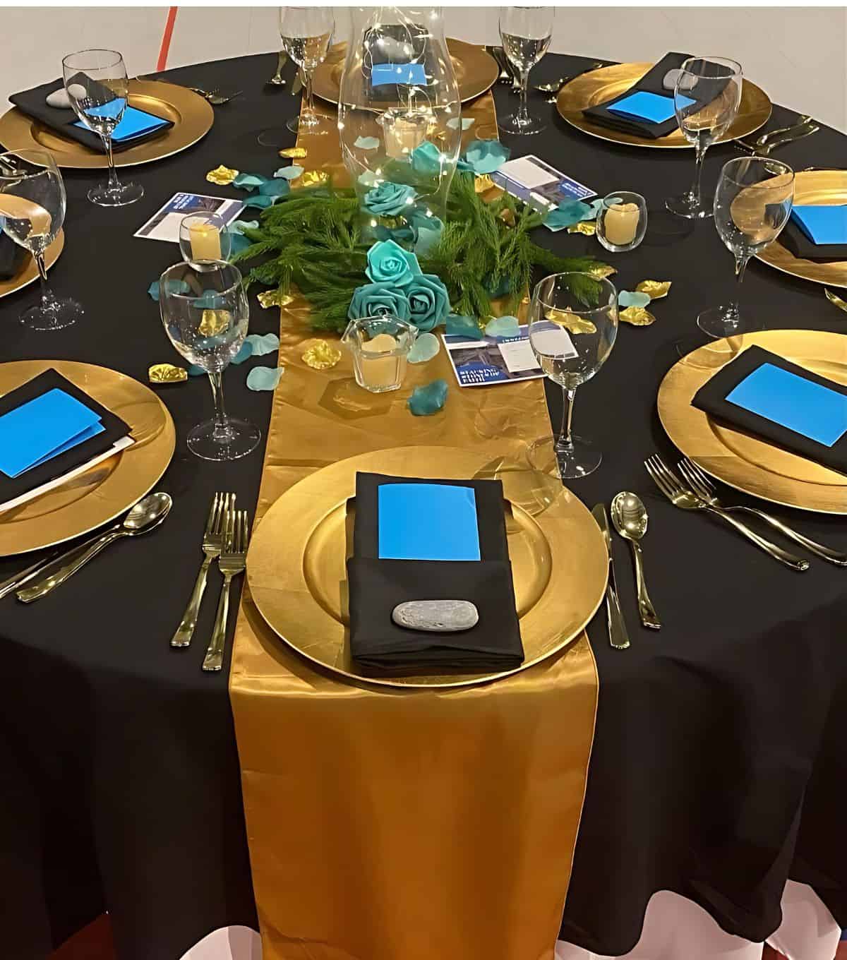 elegant banquet tablescape with black, bronze and teal