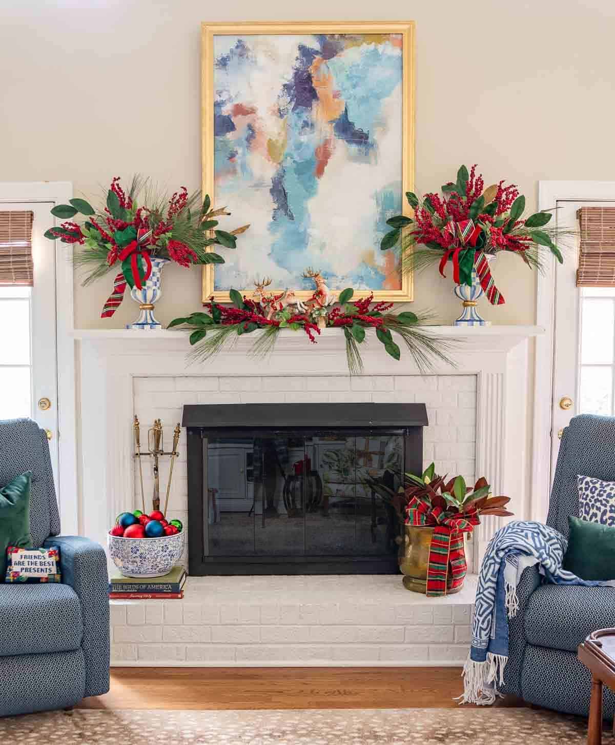 white brick fireplace and mantel decorated with traditional red and green for Christmas