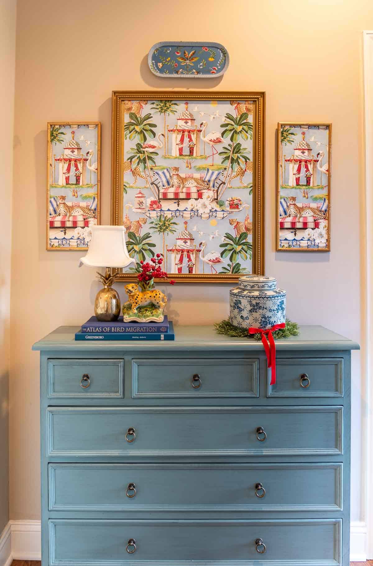 blue chest and chinoiserie artwork and accessories