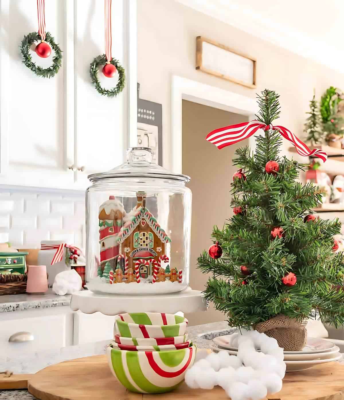 mini Christmas tree vignette on a kitchen island