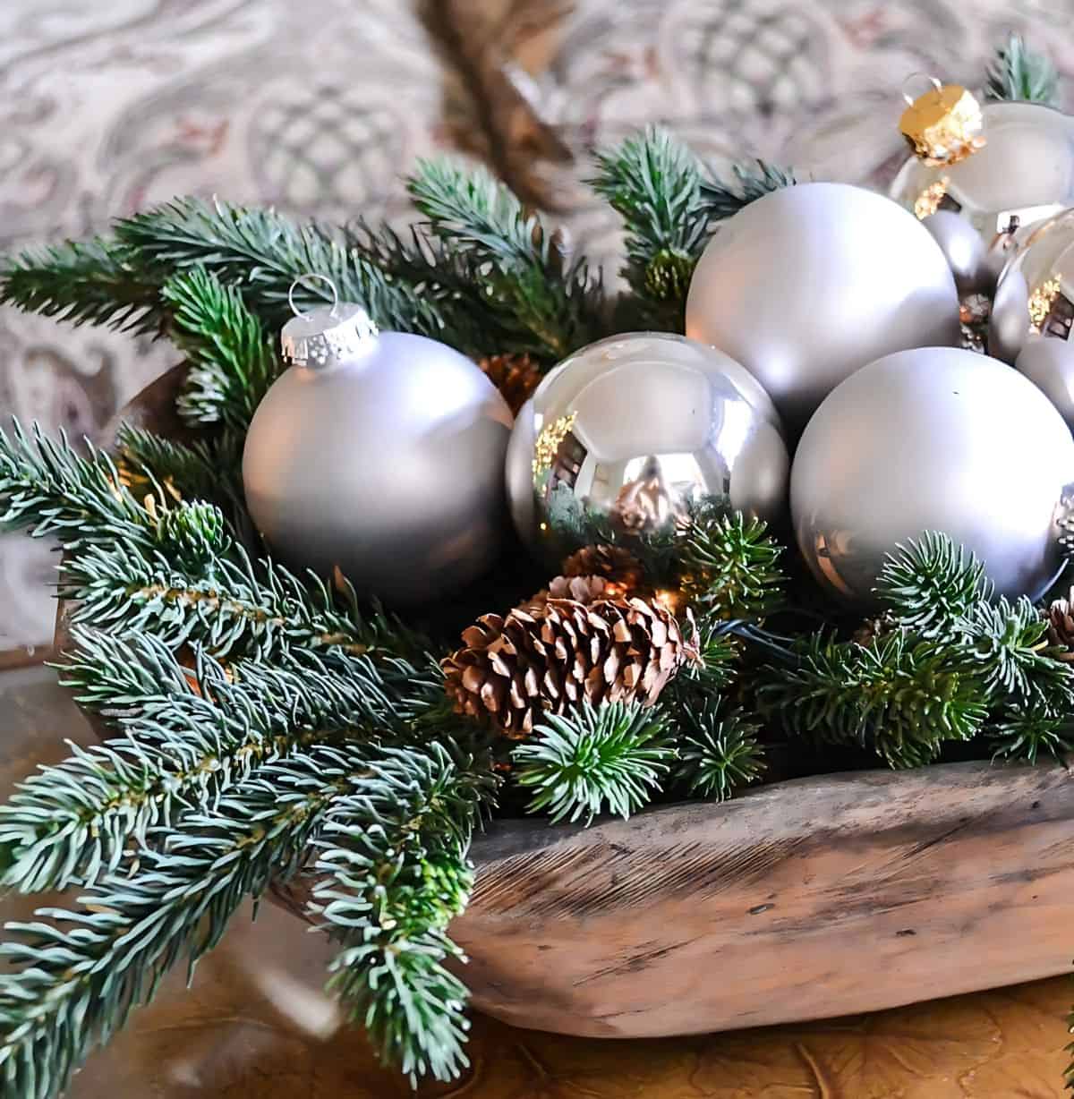 silver and fresh greenery in a dough bowl