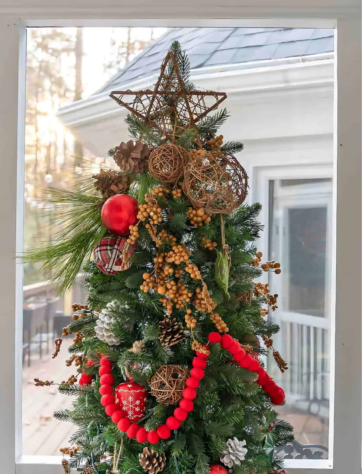 decorated Christmas tree and tree topper