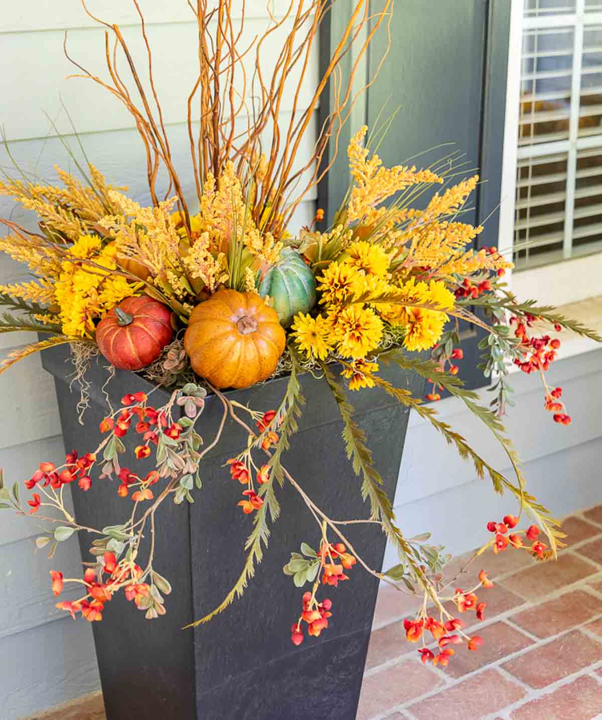 fall arrangement in a square planter