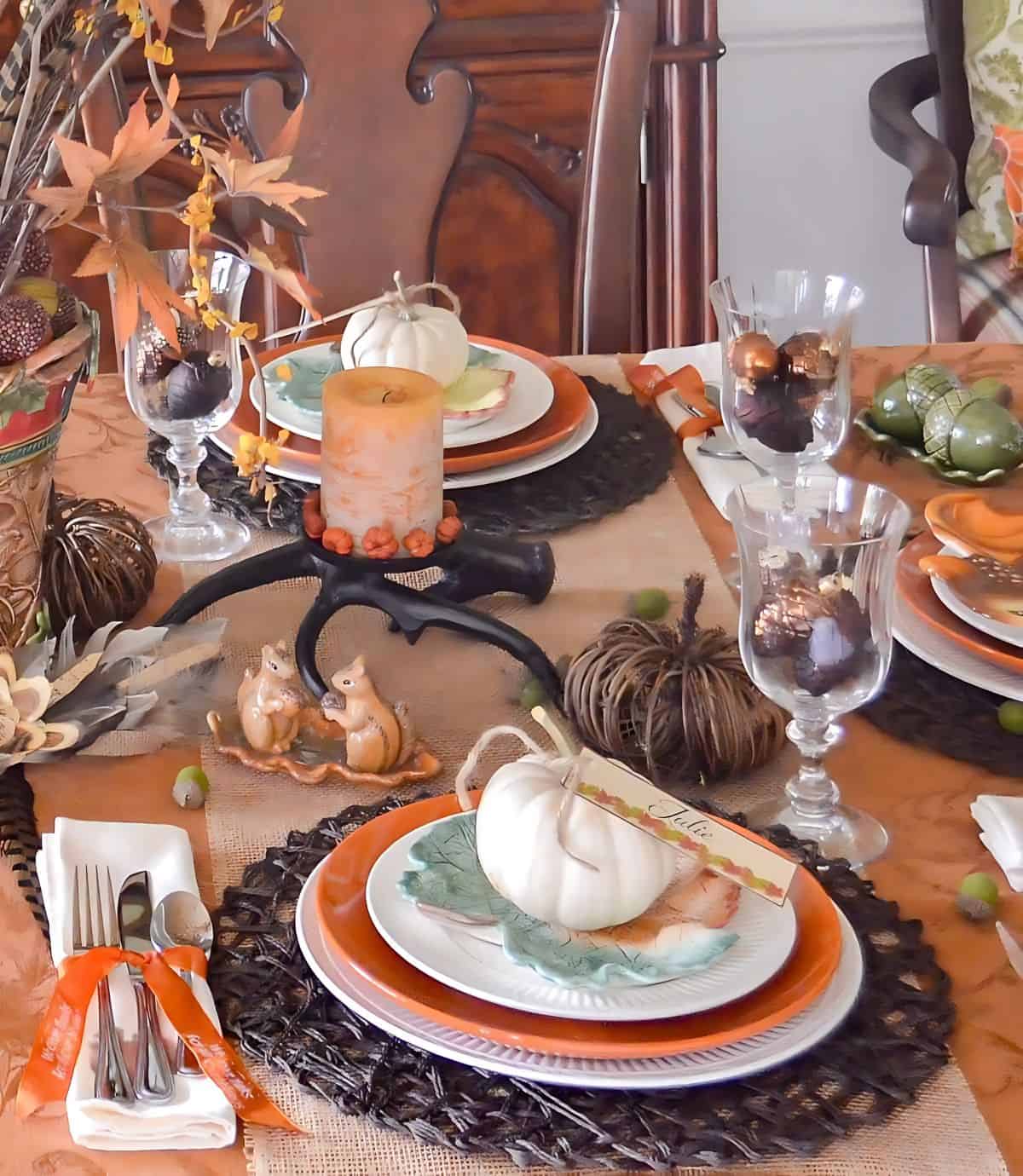 bountiful thanksgiving tablescape set with a variety of fall and traditional thanksgiving colors and elements