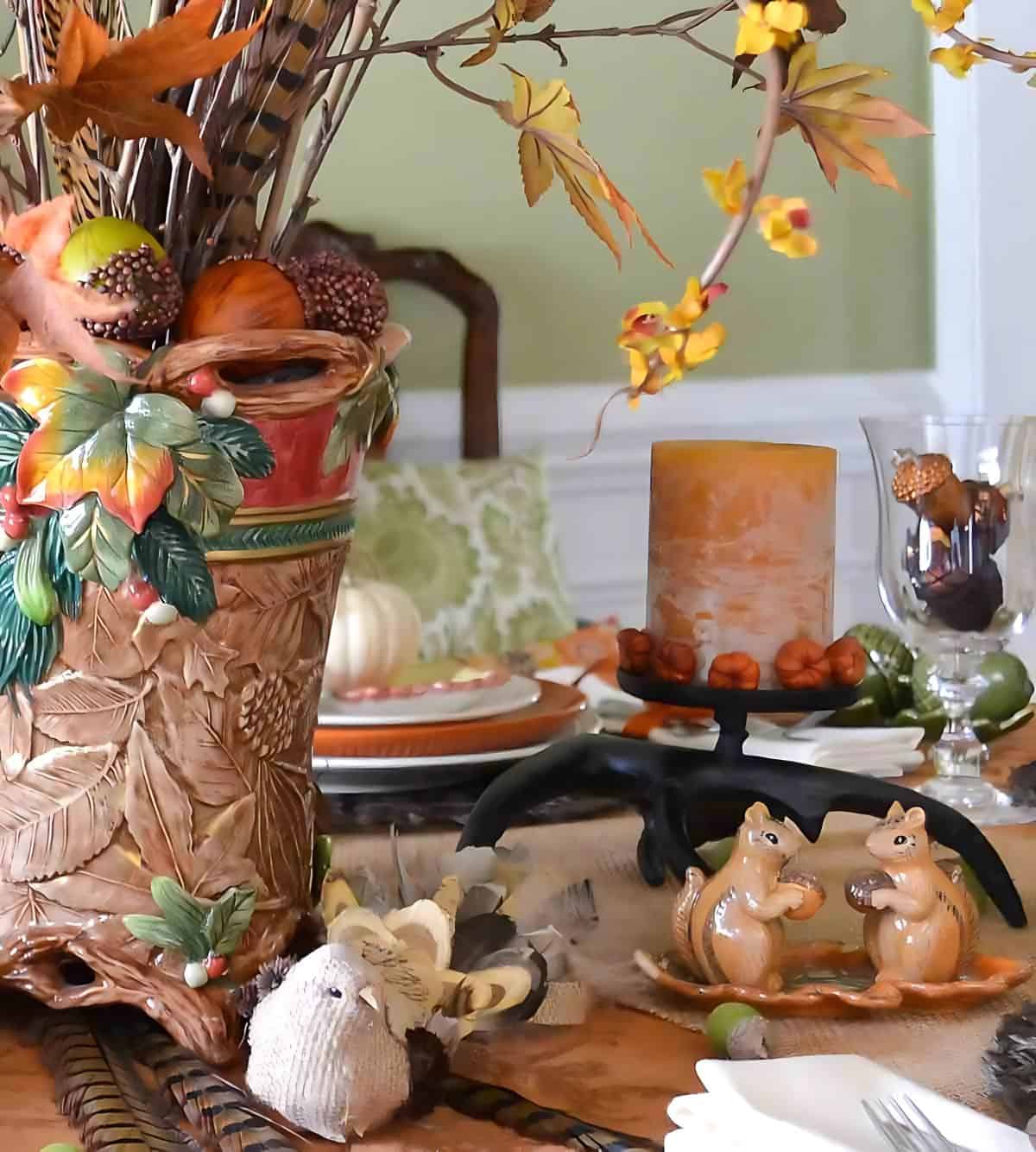 bountiful thanksgiving tablescape set with a variety of fall and traditional thanksgiving colors and elements