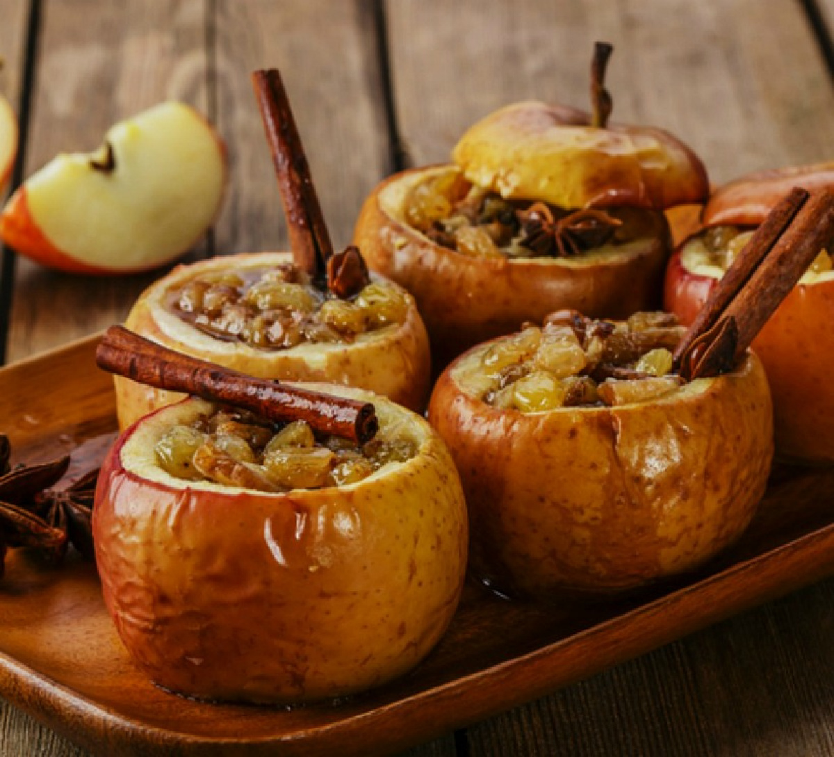 wood tray holding 4 baked honeycrisp apples