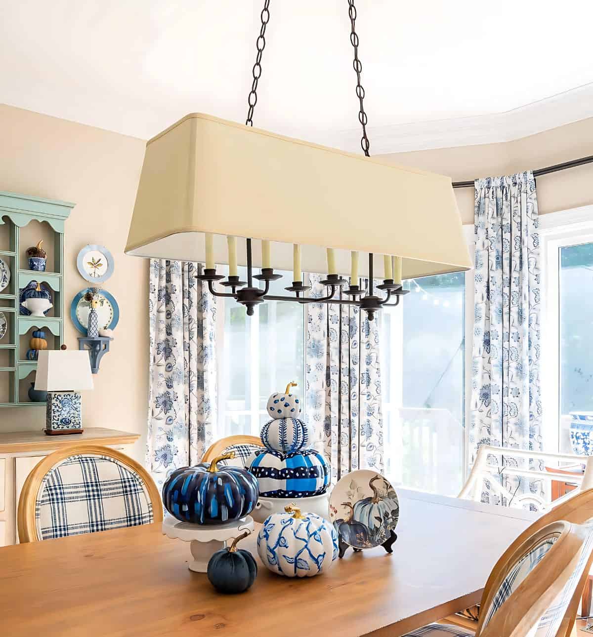 blue and white DIY painted pumpkins used as a centerpiece