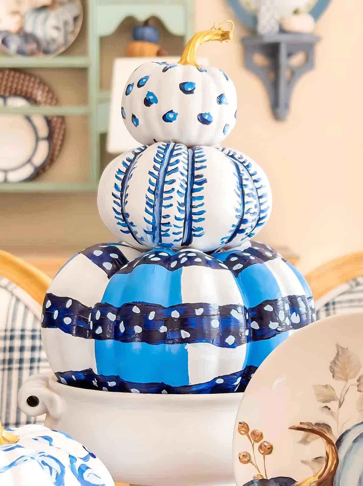 blue and white DIY painted pumpkins used as a centerpiece