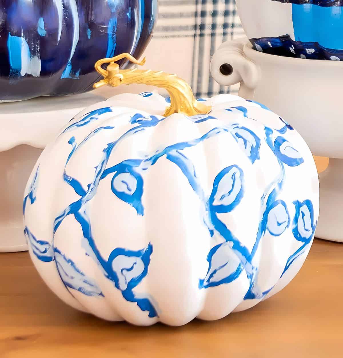 blue and white DIY painted pumpkins used as a centerpiece