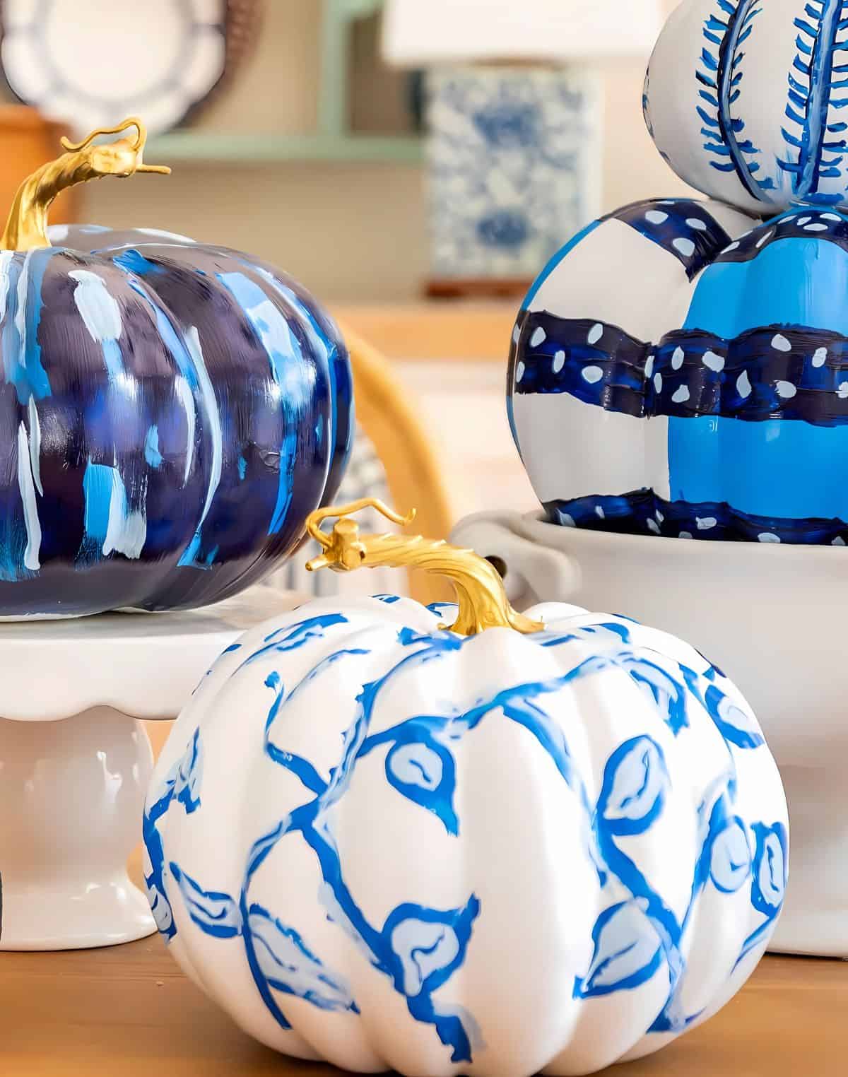 blue and white DIY painted pumpkins used as a centerpiece